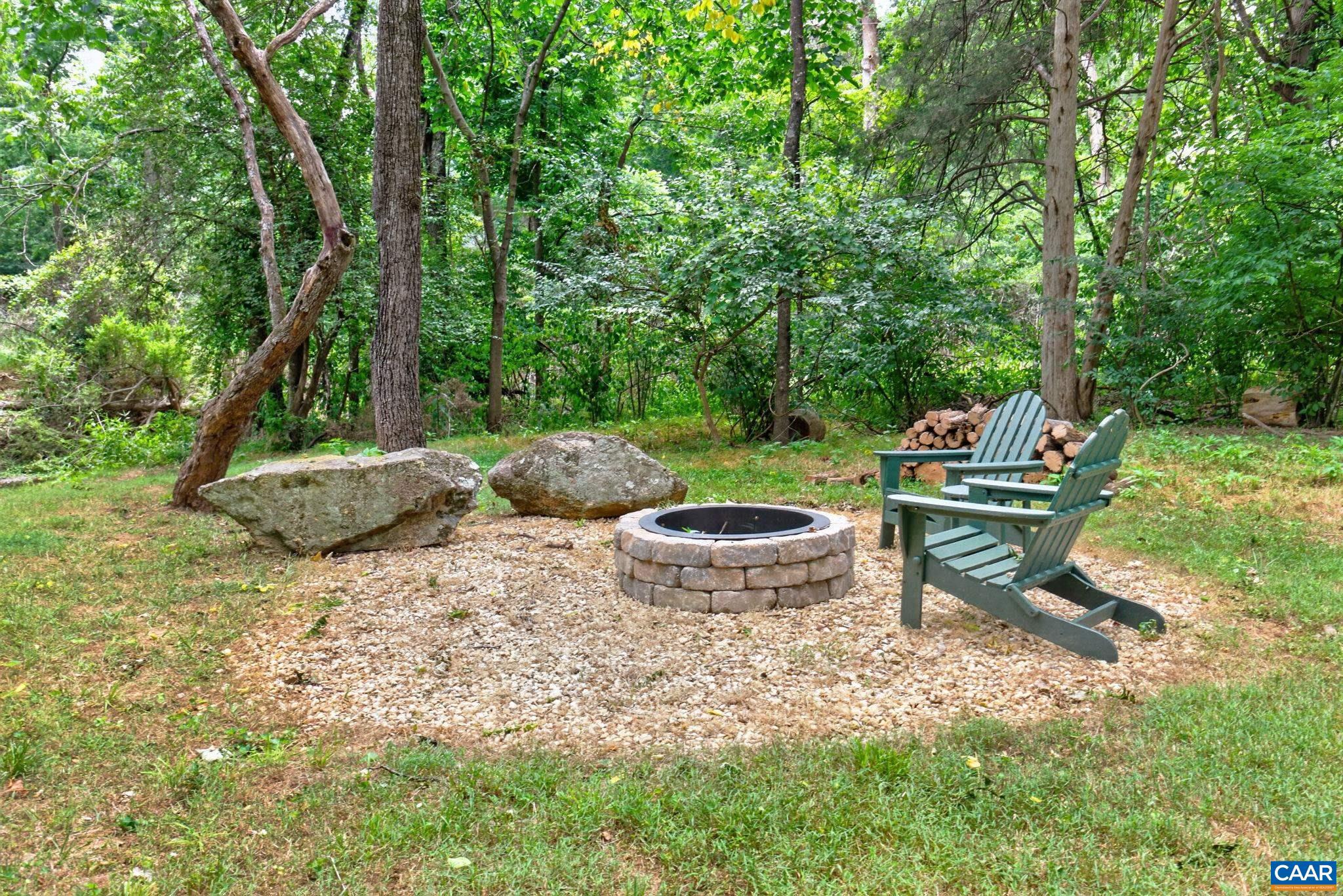 6285 Jarmans Gap Road Crozet, VA 22932 - Photo 46 of 65 a view of a backyard with plants and garden