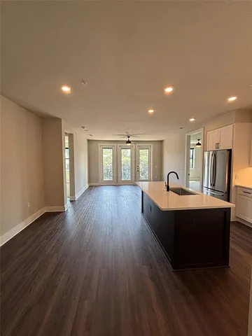 a view of kitchen with wooden floor