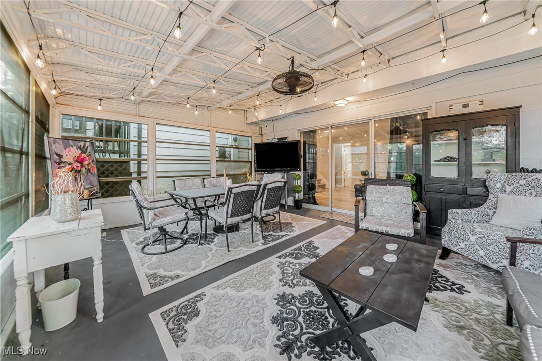 595 Moorfield Road Fairlawn, OH 44313 - Photo 35 of 50 Sunroom featuring finished concrete flooring and track lighting