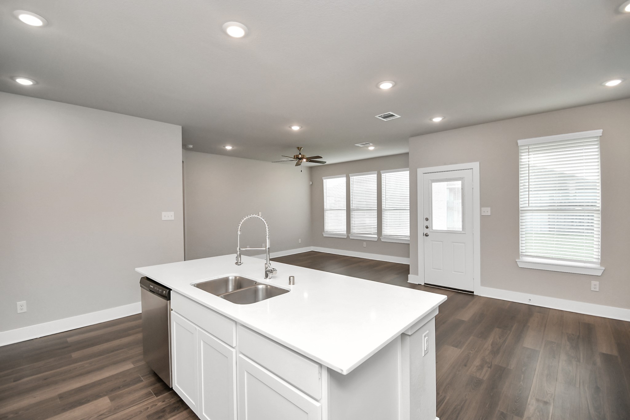 1234 Scarlet Crk Drive Rosharon, TX 77583 - Photo 5 of 21 Another view from the kitchen looking into the family room shows the extensive storage including a pantry next to the refrigerator.