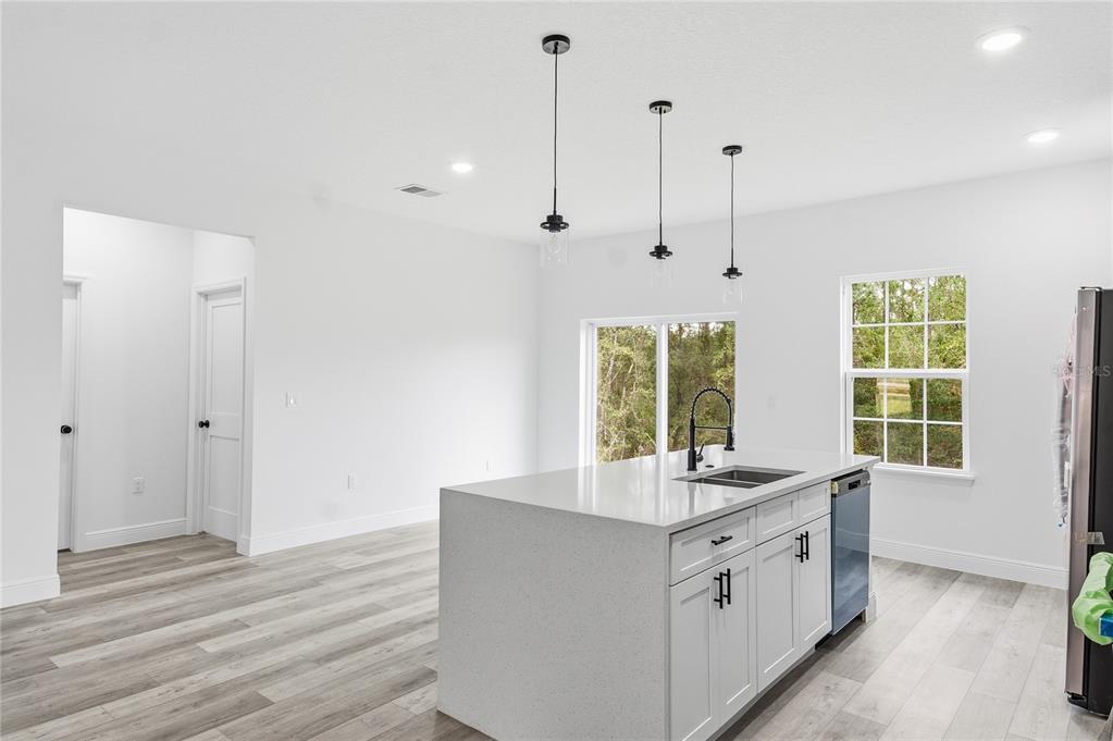6312 Southwest 144th Lane Road Ocala, FL 34473 - Photo 13 of 32 a bathroom with a granite countertop sink and a window