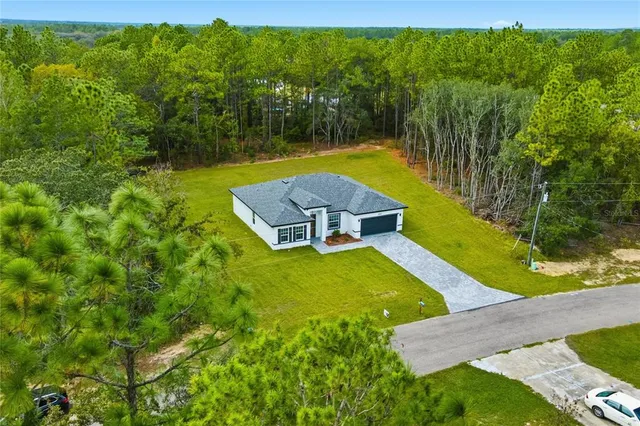 a view of a swimming pool with a yard