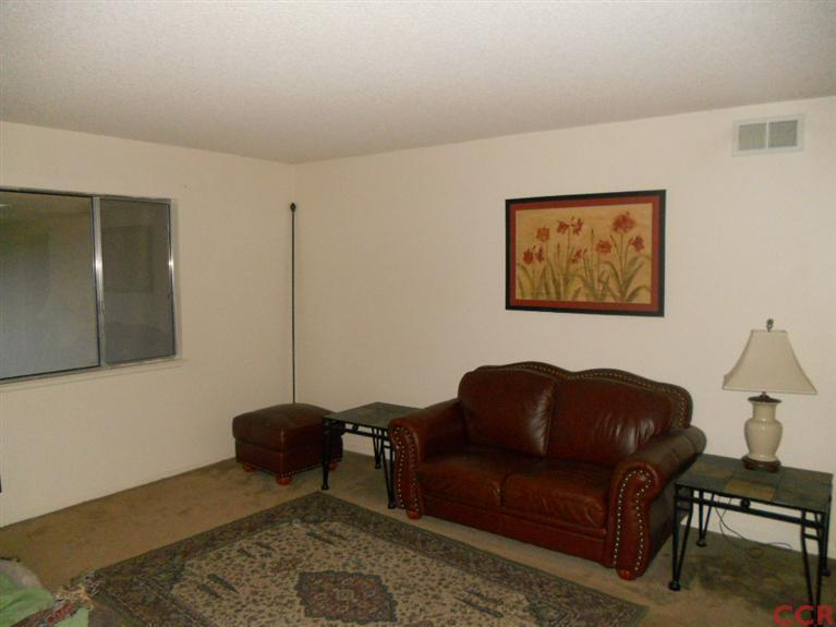1151 Onstott Road Lompoc, CA 93436 - Photo 10 of 21 a living room with furniture a rug and a window
