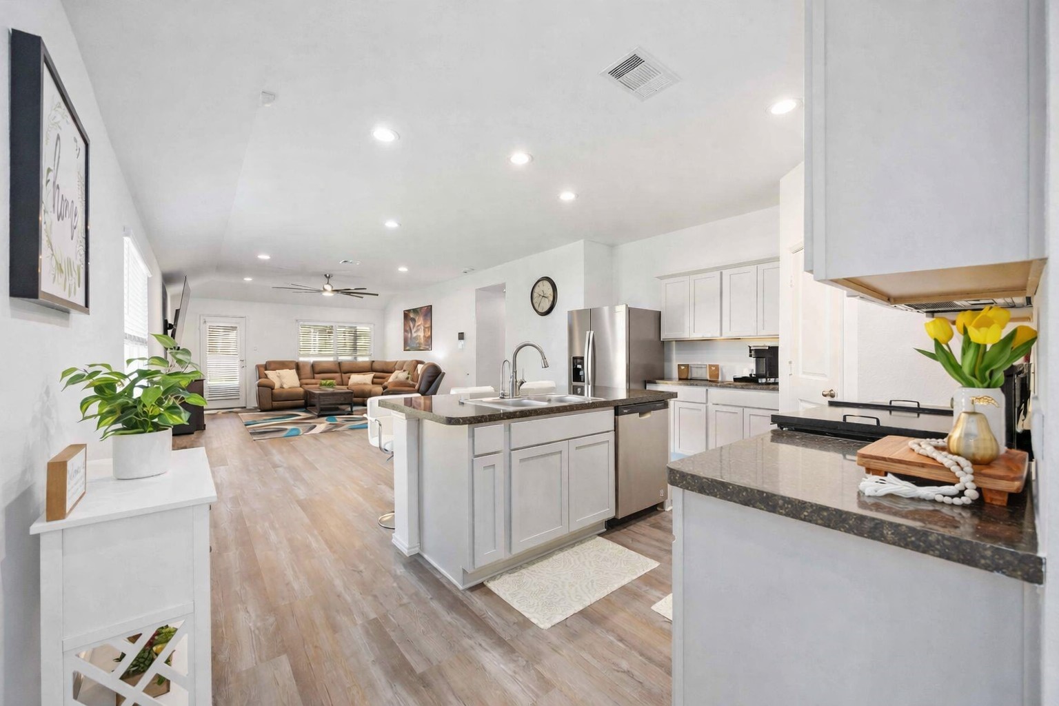 24034 Sunview Vly Drive Spring, TX 77373 - Photo 13 of 43 Open-Concept Kitchen & Living Area
Bright, open-concept living space anchored by a spacious kitchen with a large center island, ample cabinetry, and generous counter space—perfect for everyday living and entertaining. The layout flows seamlessly into the main living area, creating a welcoming environment ideal for hosting, relaxing, or working from home.