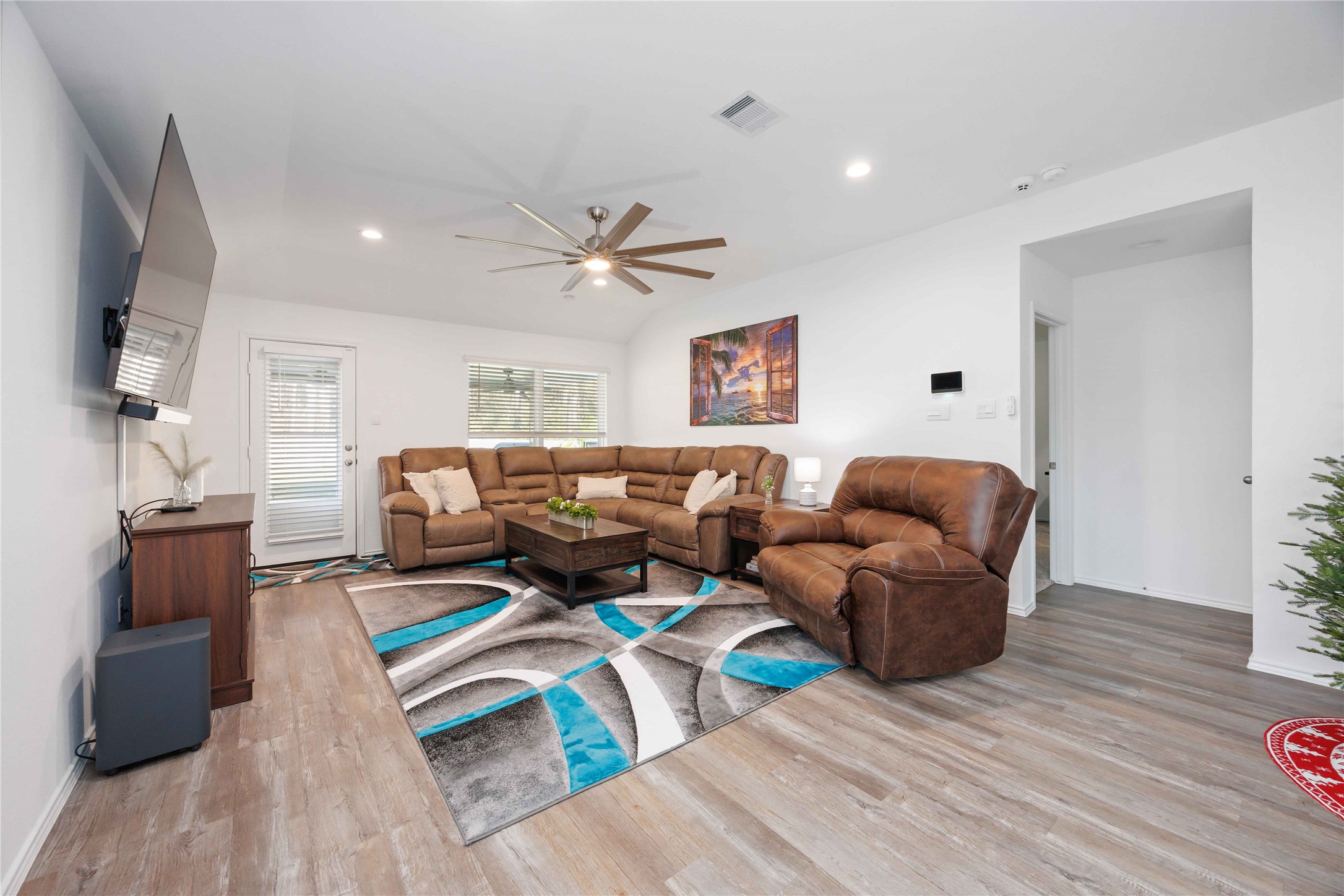 24034 Sunview Vly Drive Spring, TX 77373 - Photo 18 of 43 a living room with furniture and a wooden floor