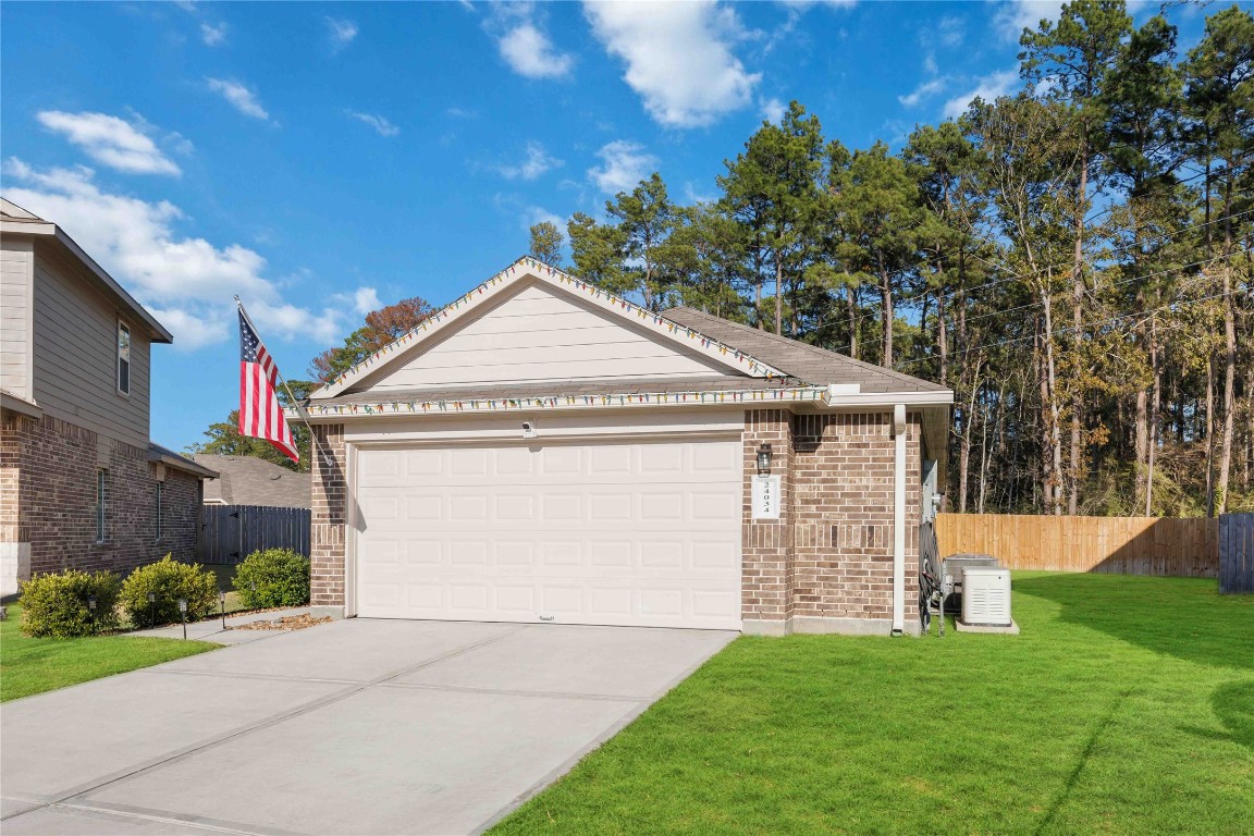 24034 Sunview Vly Drive Spring, TX 77373 - Photo 2 of 43 a front view of a house with a garden