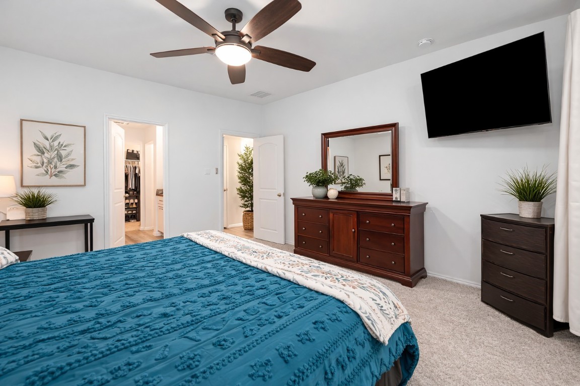 24034 Sunview Vly Drive Spring, TX 77373 - Photo 24 of 43 a bedroom with a bed and a flat screen tv