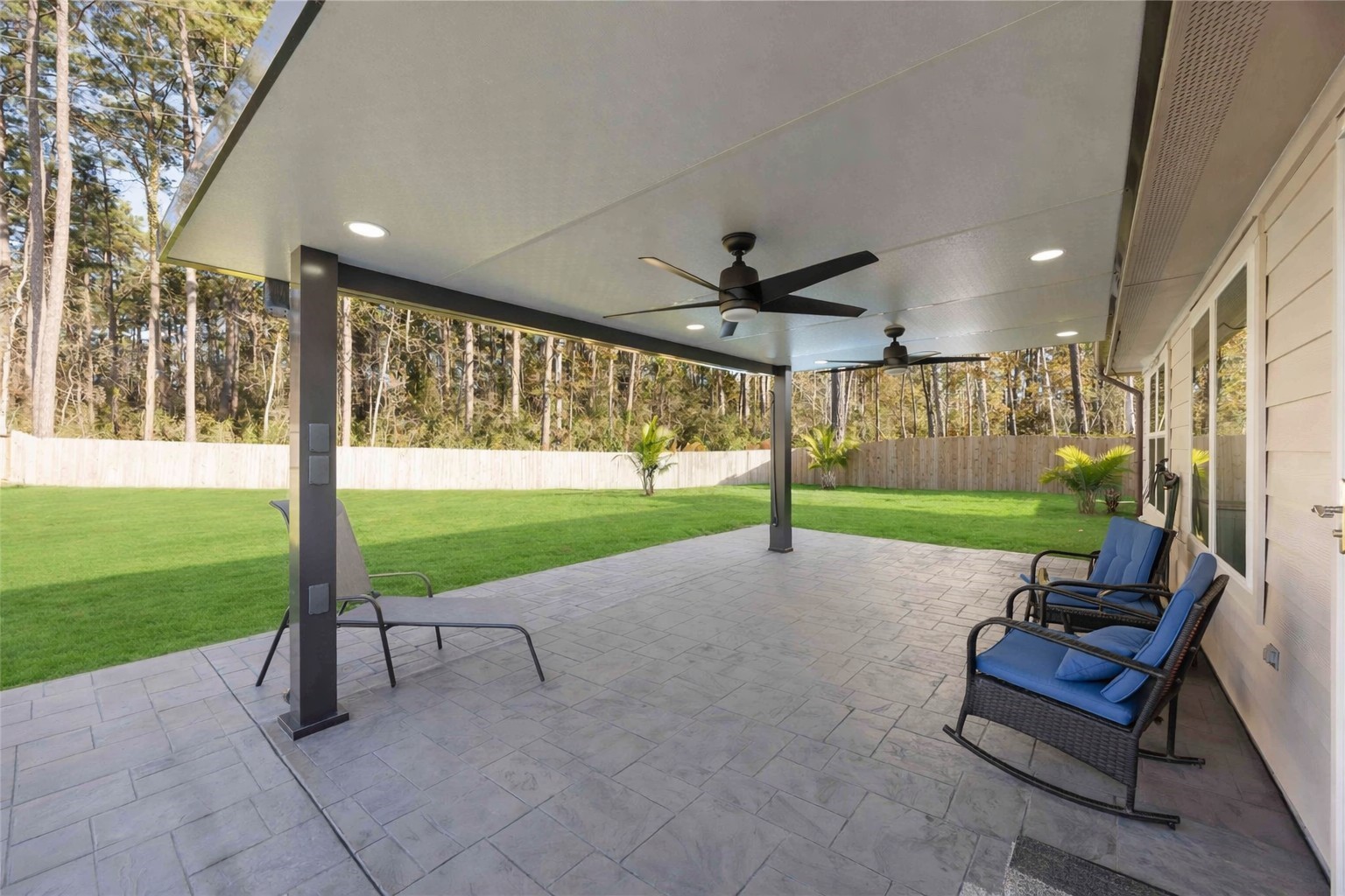 24034 Sunview Vly Drive Spring, TX 77373 - Photo 6 of 43 Covered Patio – Outdoor Living Space
Spacious covered patio designed for year-round enjoyment, featuring ceiling fans, recessed lighting, and ample room for lounging, dining, and grilling. Overlooking the expansive backyard with no back neighbors, this private outdoor retreat is ideal for entertaining, relaxing, or enjoying quiet evenings outdoors. A seamless extension of the home that elevates both everyday living and gatherings.
