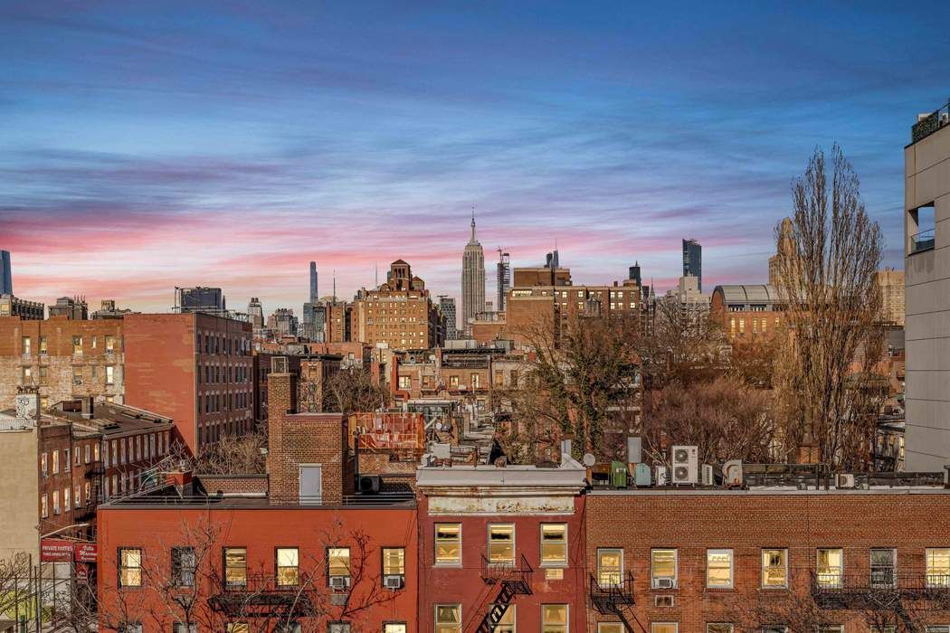 64 MacDougal Street, Unit 22 Manhattan, NY 10012 - Photo 9 of 13 a view of a city with tall buildings