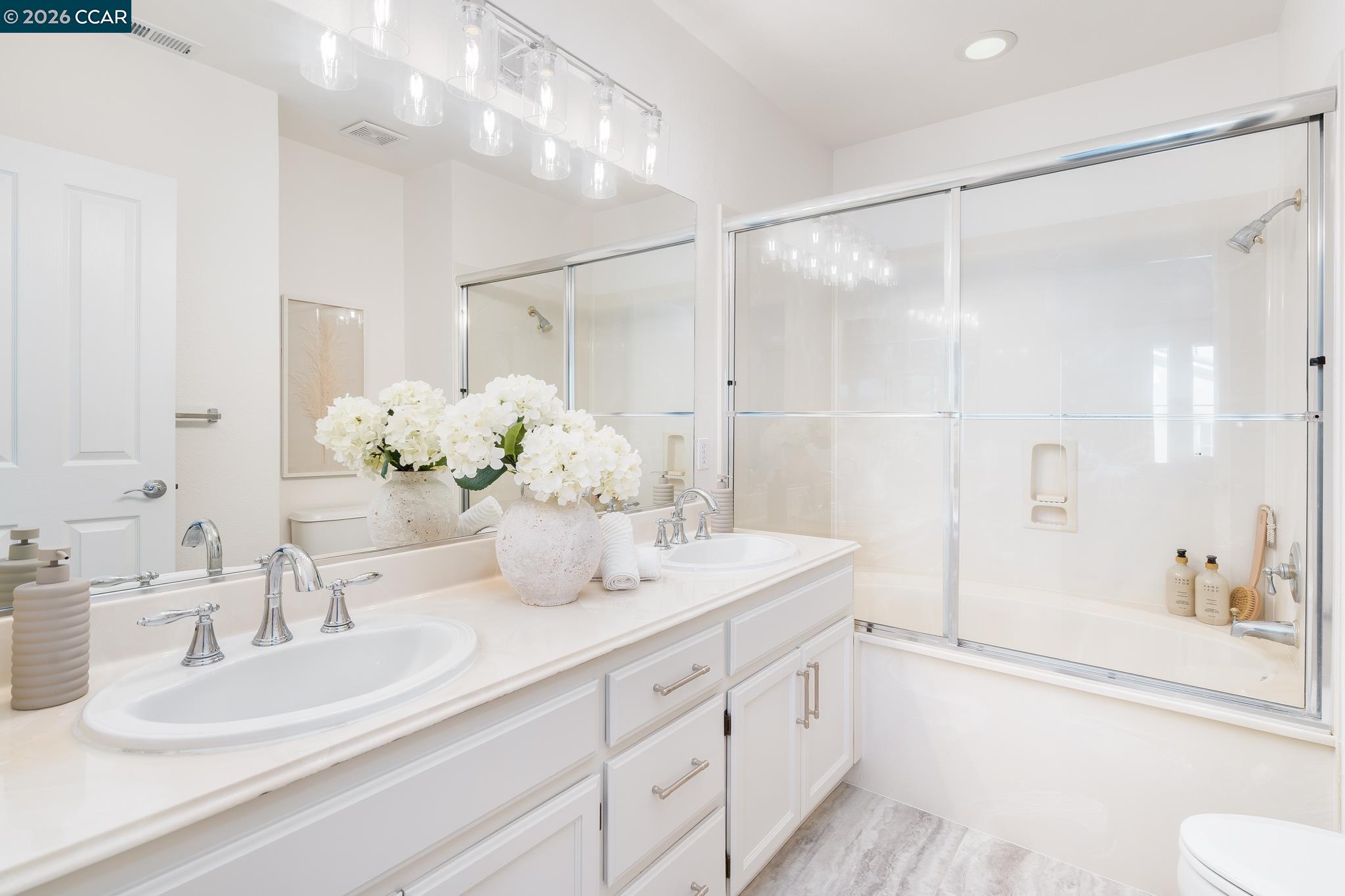 7110 Briza Loop San Ramon, CA 94582 - Photo 12 of 25 a bathroom with a double vanity sink mirror and shower