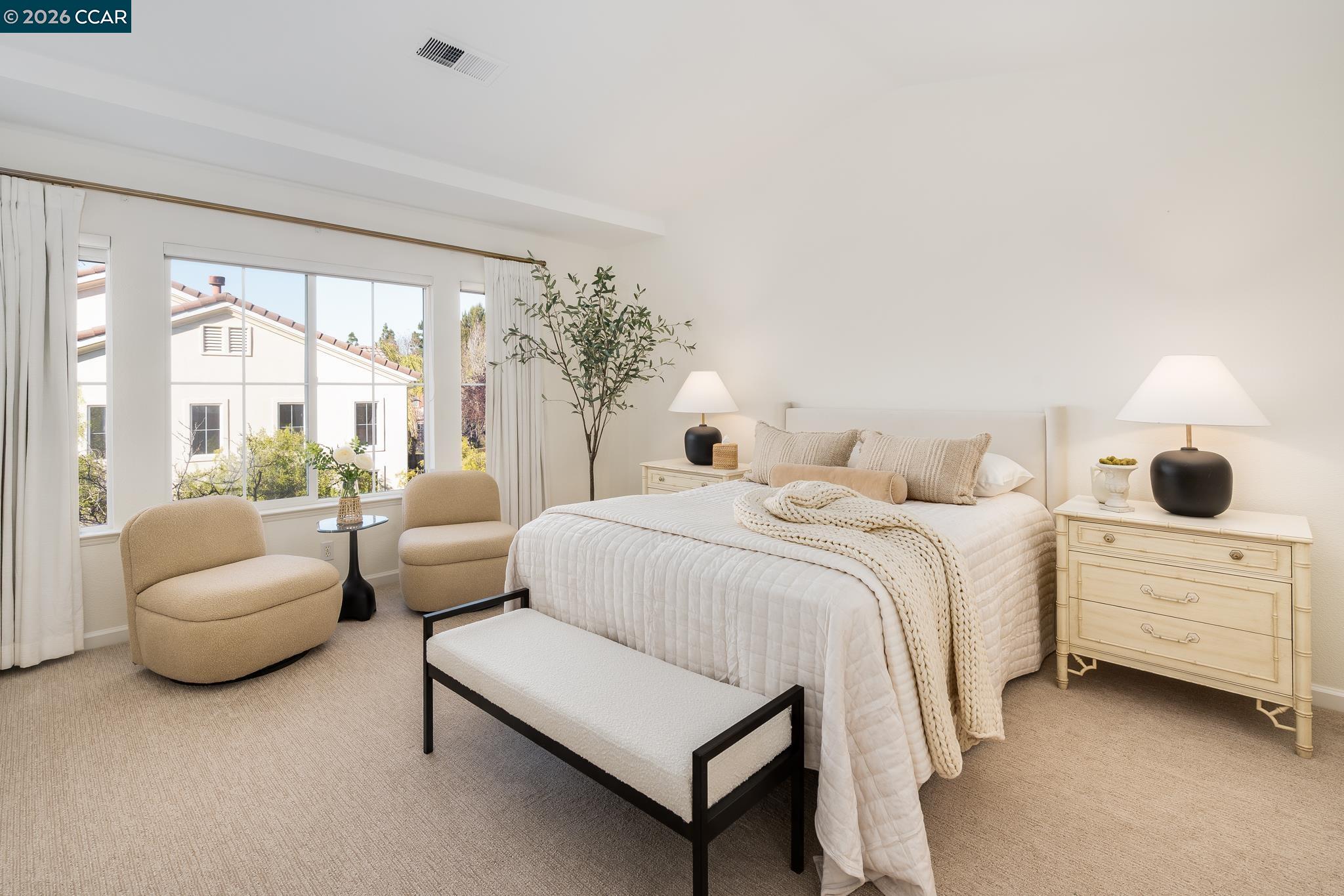 7110 Briza Loop San Ramon, CA 94582 - Photo 13 of 25 a spacious bedroom with a bed and a couch