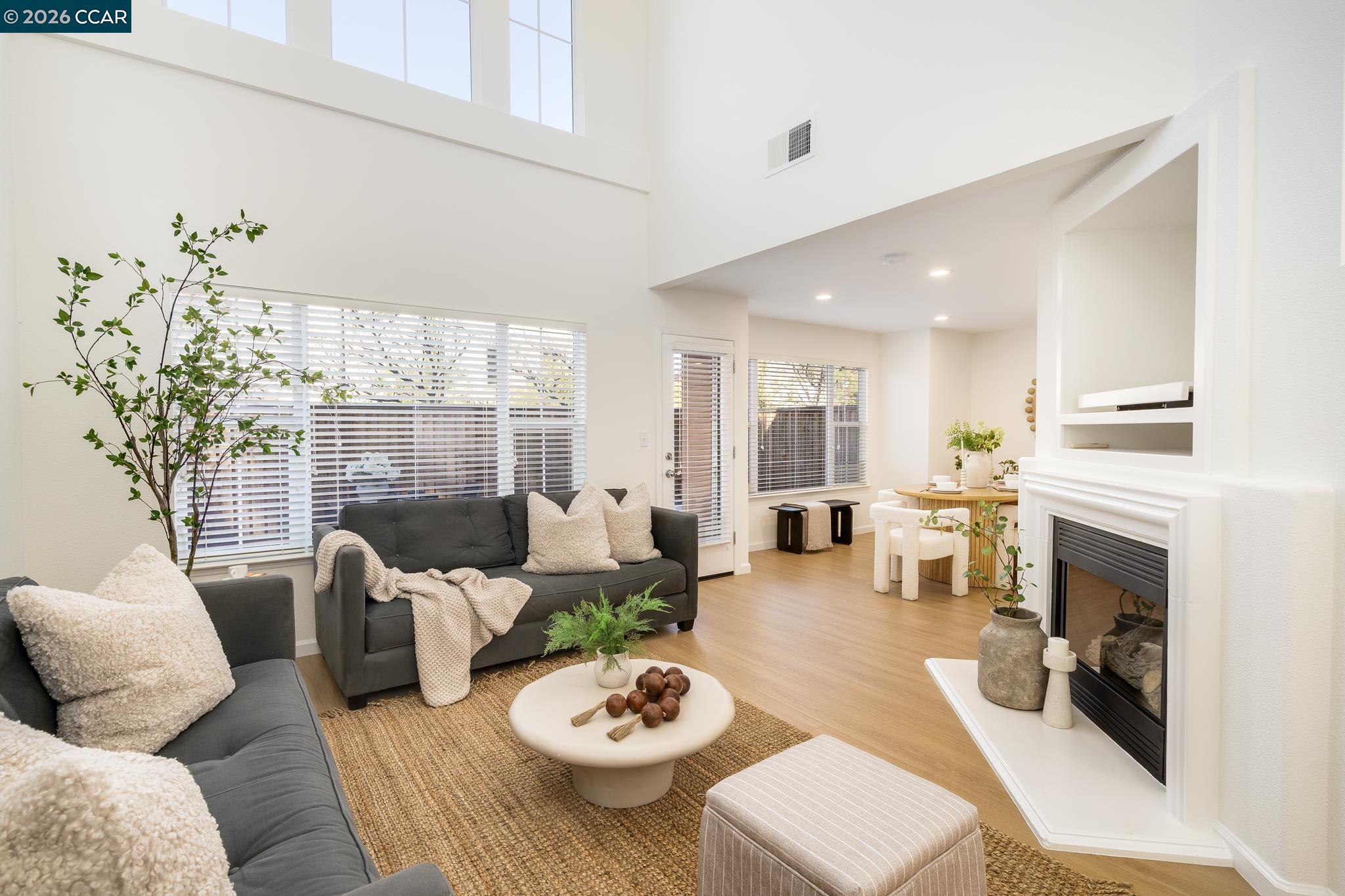 7110 Briza Loop San Ramon, CA 94582 - Photo 3 of 25 a living room with furniture fireplace and a table
