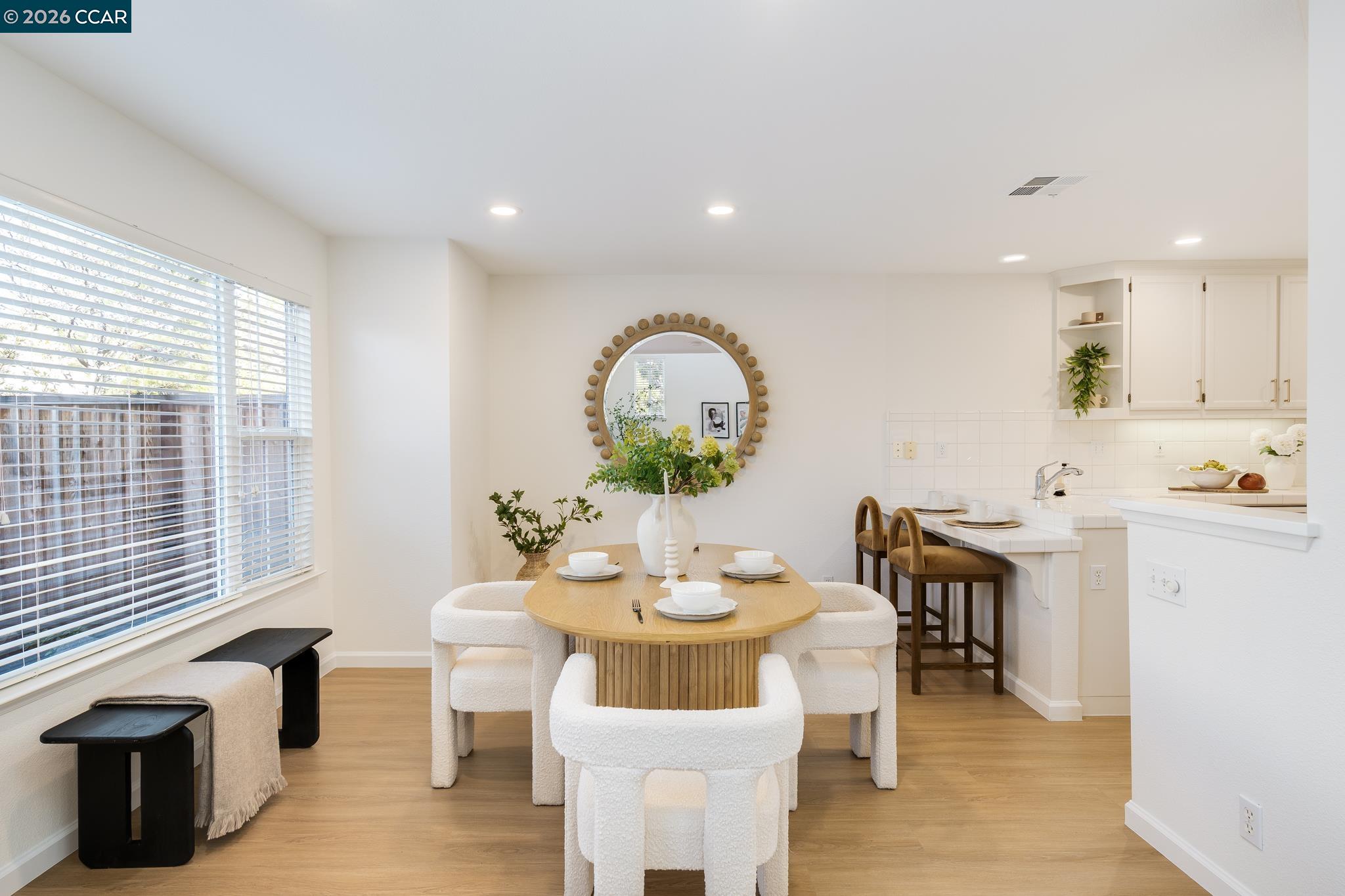 7110 Briza Loop San Ramon, CA 94582 - Photo 6 of 25 a view of a dining room with furniture and wooden floor