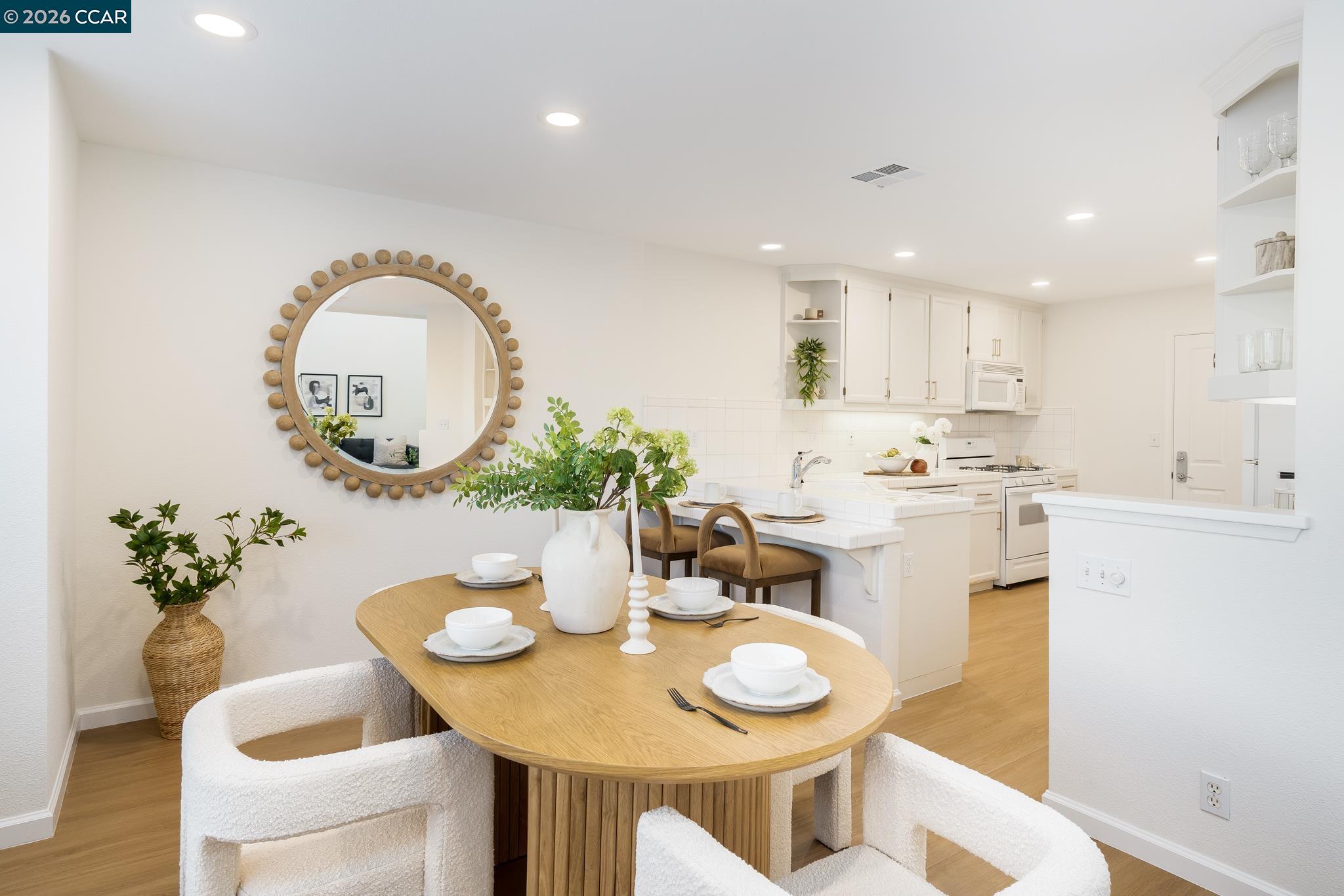 7110 Briza Loop San Ramon, CA 94582 - Photo 7 of 25 a kitchen with a dining table and chairs
