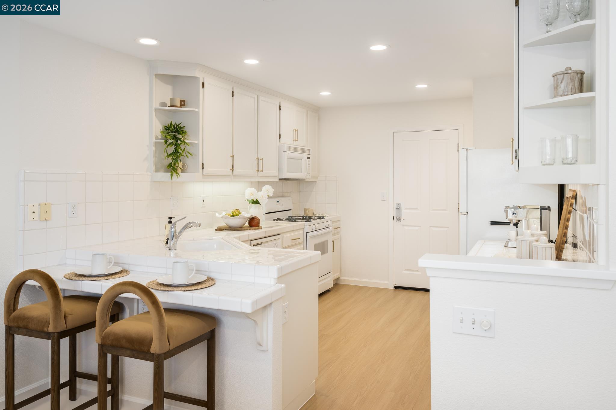 7110 Briza Loop San Ramon, CA 94582 - Photo 9 of 25 a kitchen with a sink cabinets and appliances