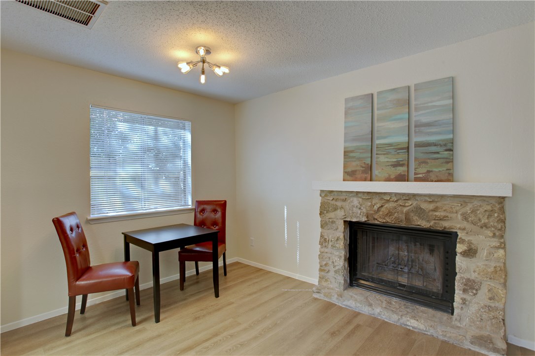 9079 Jollyville Road, Unit 303 Austin, TX 78759 - Photo 12 of 25 a view of a livingroom with furniture and a fireplace