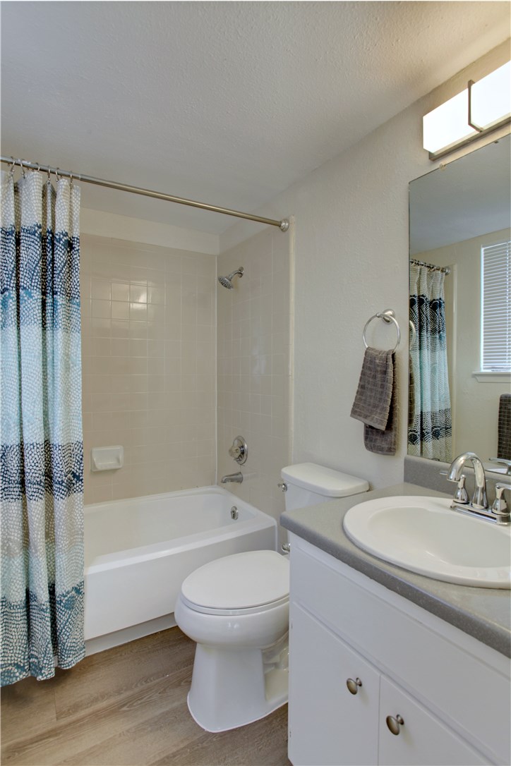 9079 Jollyville Road, Unit 303 Austin, TX 78759 - Photo 19 of 25 a bathroom with a sink a toilet and shower