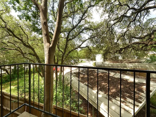 a view of outdoor space with deck and tree