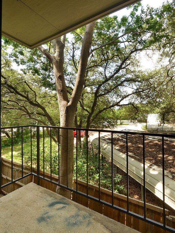 9079 Jollyville Road, Unit 303 Austin, TX 78759 - Photo 23 of 25 a view of outdoor space with deck and tree