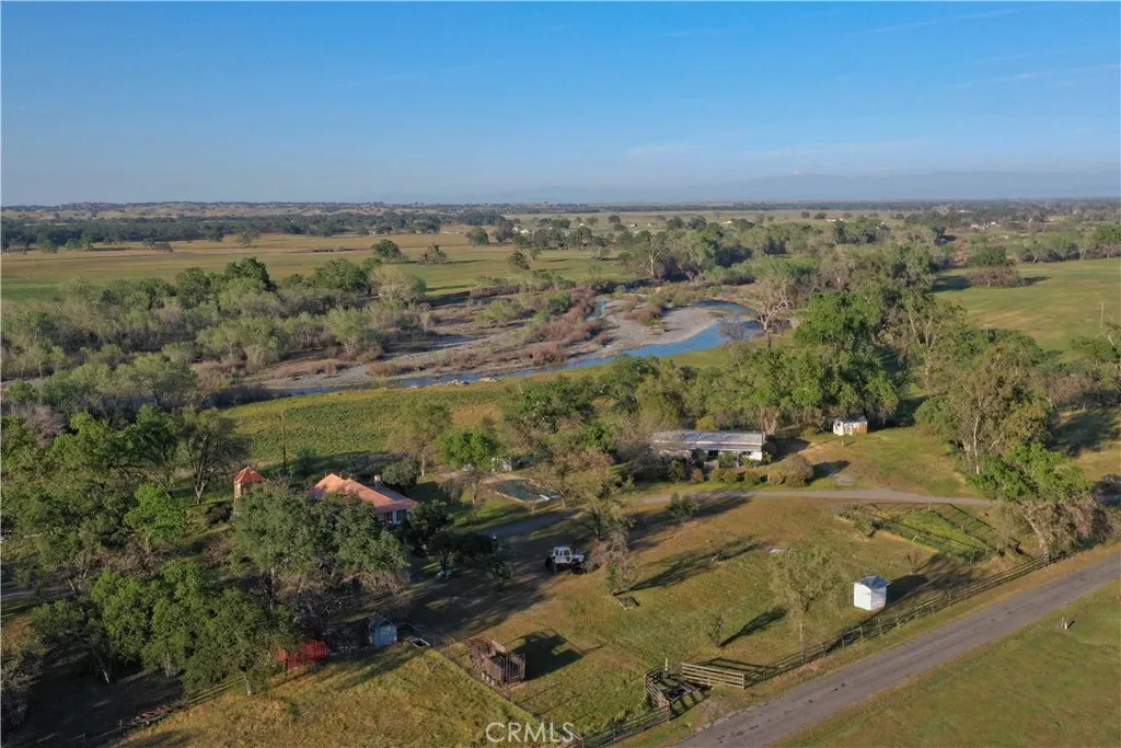 an aerial view of residential building and lake