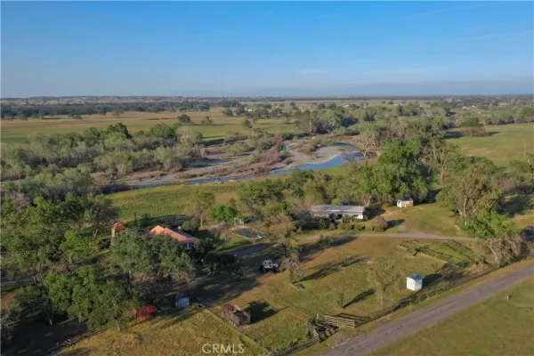 an aerial view of residential building and lake