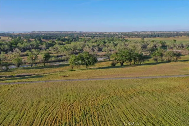 a view of lake with green space