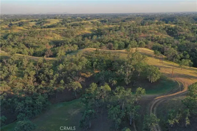 a bed sitting in a room next to a window