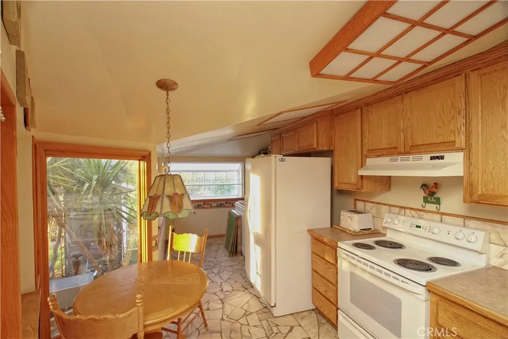 15385 Weston Road Corning, CA 96029 - Photo 56 of 75 a kitchen that has a stove and a refrigerator