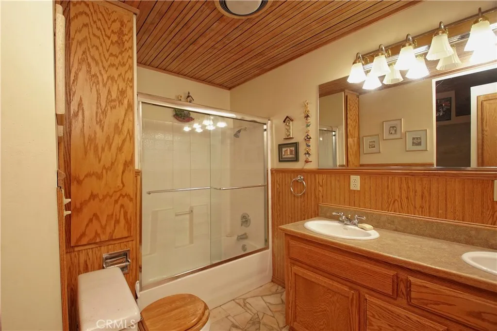 15385 Weston Road Corning, CA 96029 - Photo 69 of 75 a bathroom with a sink a vanity and shower