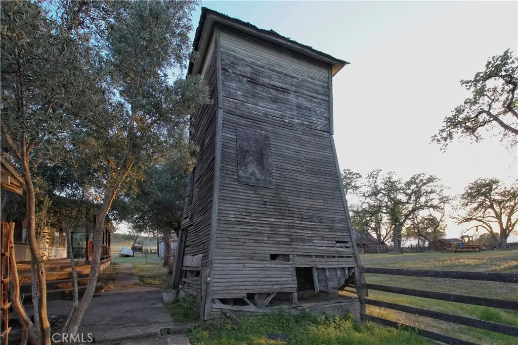 15385 Weston Road Corning, CA 96029 - Photo 74 of 75 a backyard of a house with table and chairs and wooden fence