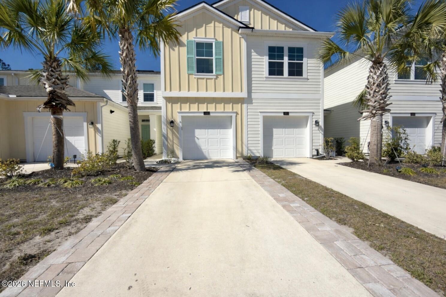a view of a house with a backyard