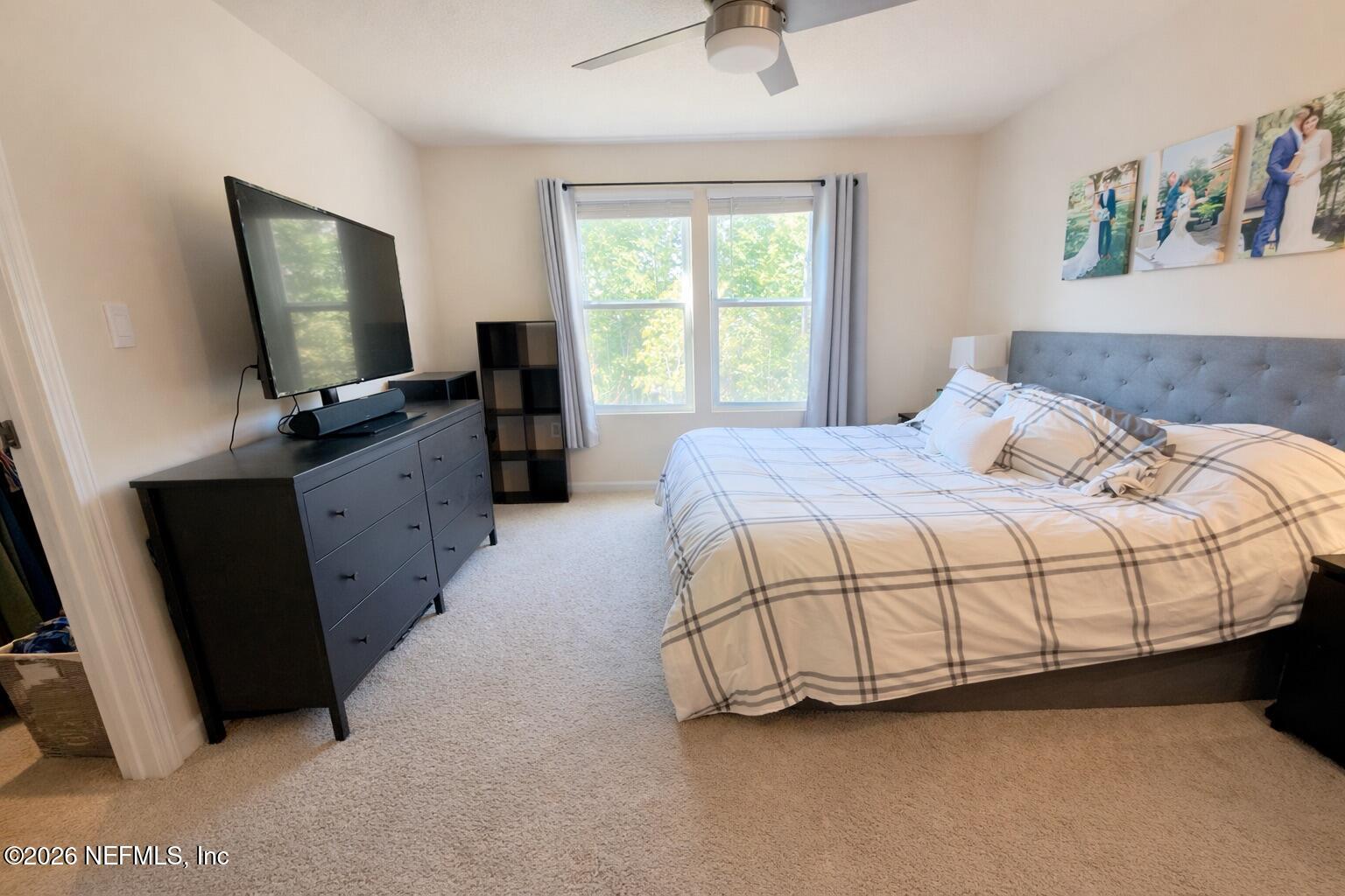 597 Coastline Way Street St. Augustine, FL 32092 - Photo 13 of 21 a bedroom with a bed and window