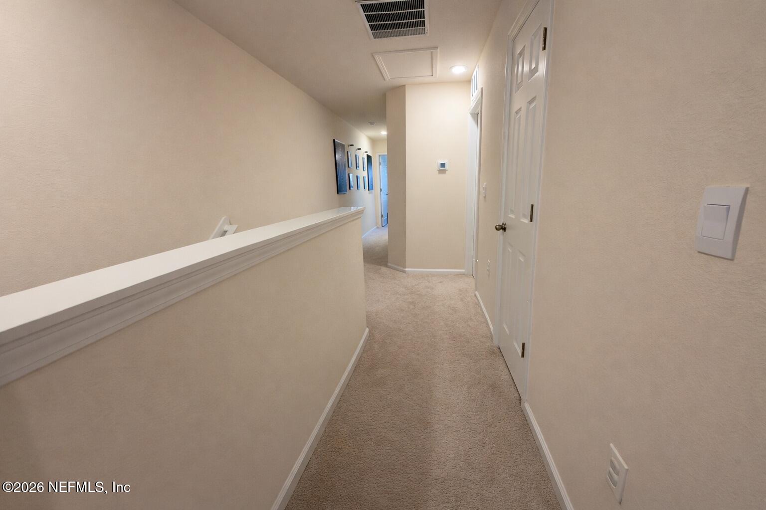 597 Coastline Way Street St. Augustine, FL 32092 - Photo 15 of 21 a view of a hallway with wooden floor