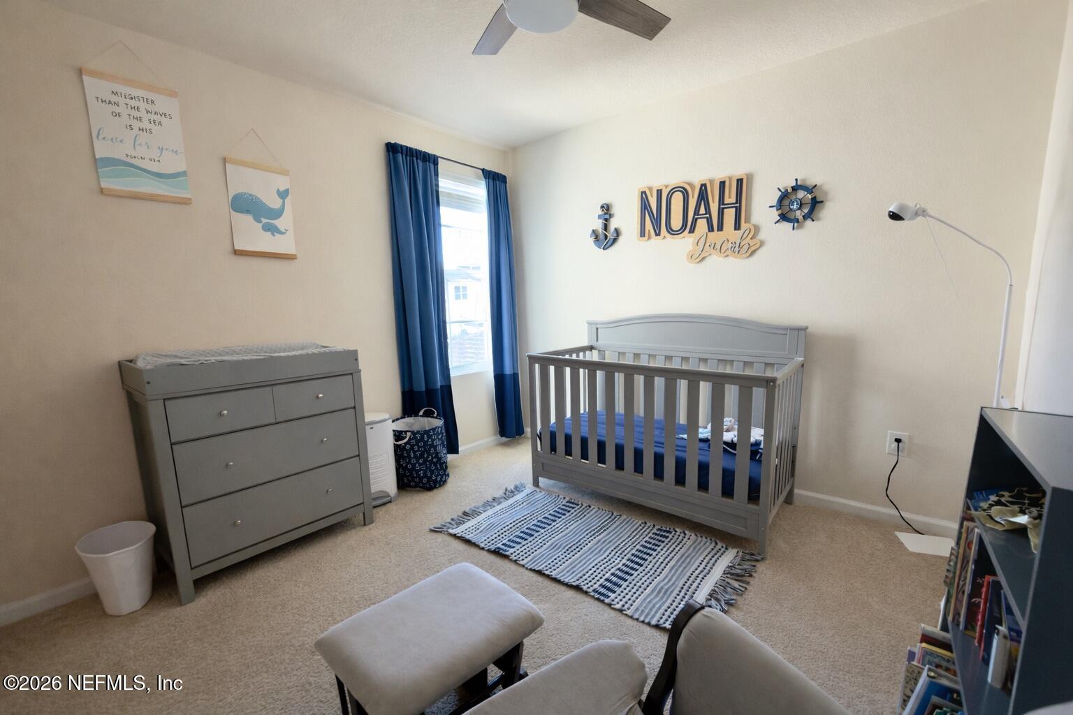 597 Coastline Way Street St. Augustine, FL 32092 - Photo 18 of 21 a bedroom with furniture and a window