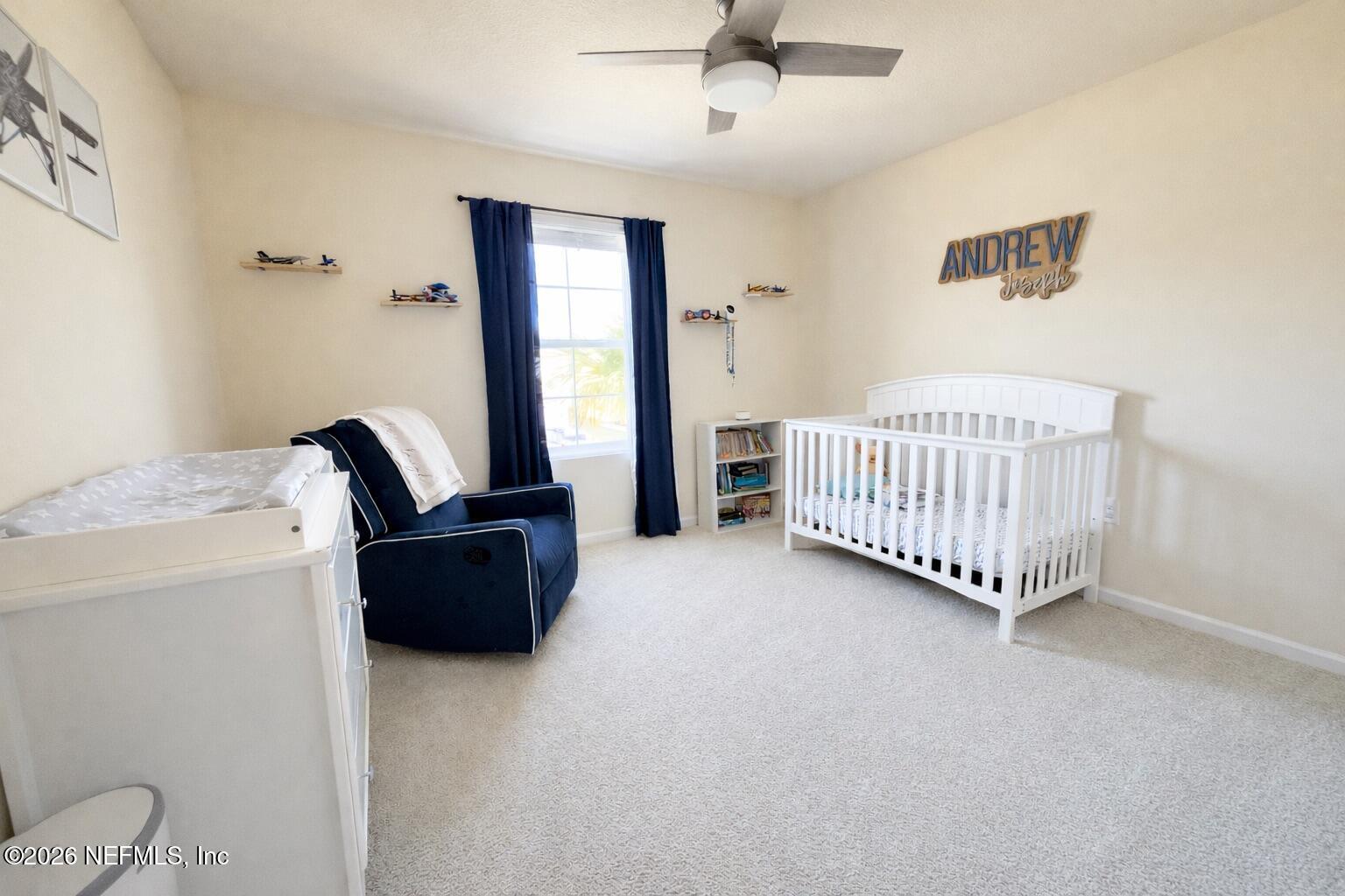 597 Coastline Way Street St. Augustine, FL 32092 - Photo 20 of 21 a living room with furniture and a window