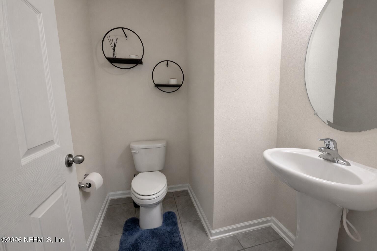 597 Coastline Way Street St. Augustine, FL 32092 - Photo 5 of 21 a bathroom with a toilet and a sink