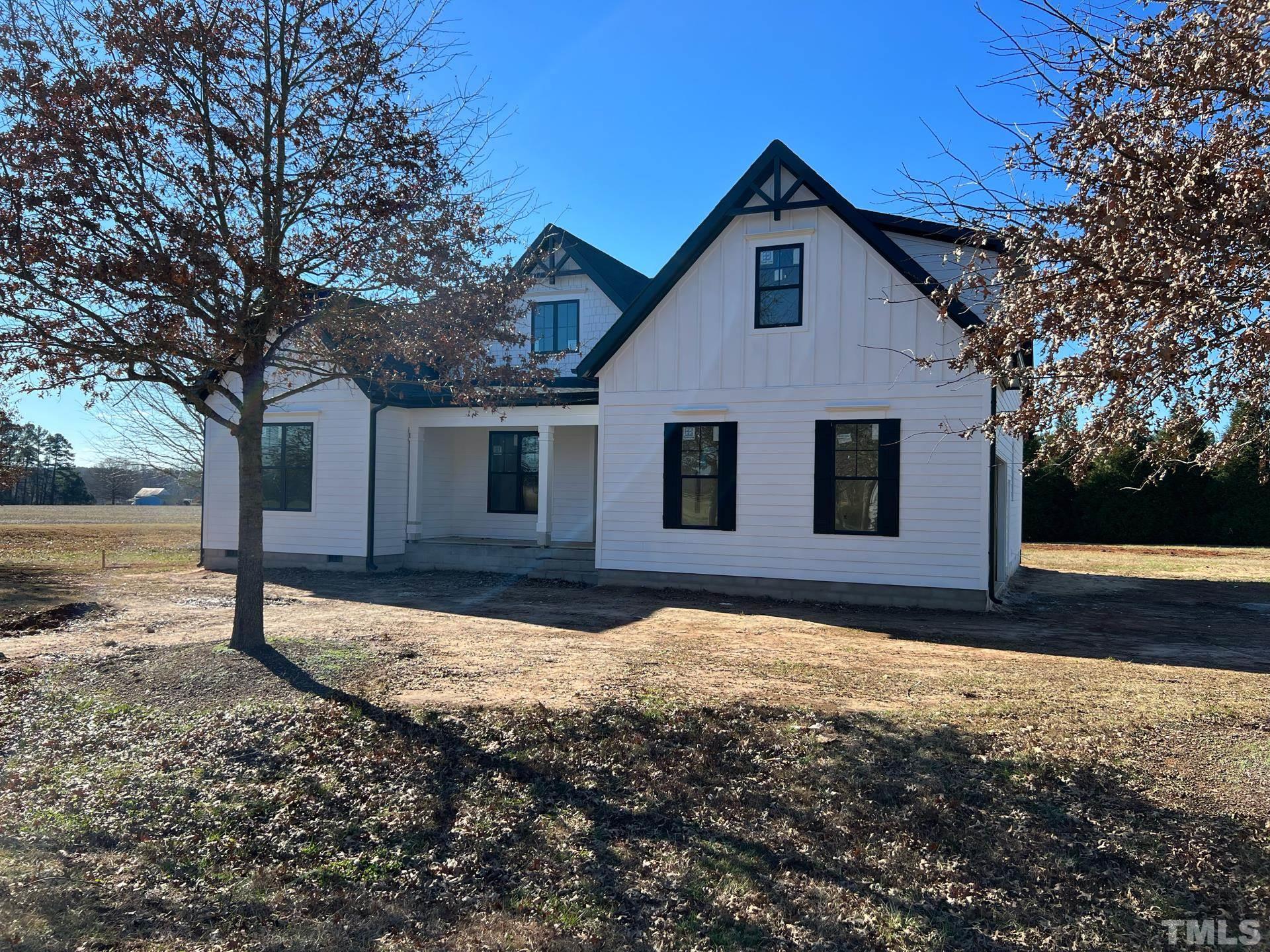 15 Tamaran Ct Spring Spring Hope, NC 27882 - Photo 3 of 29 a view of a house with backyard and trees