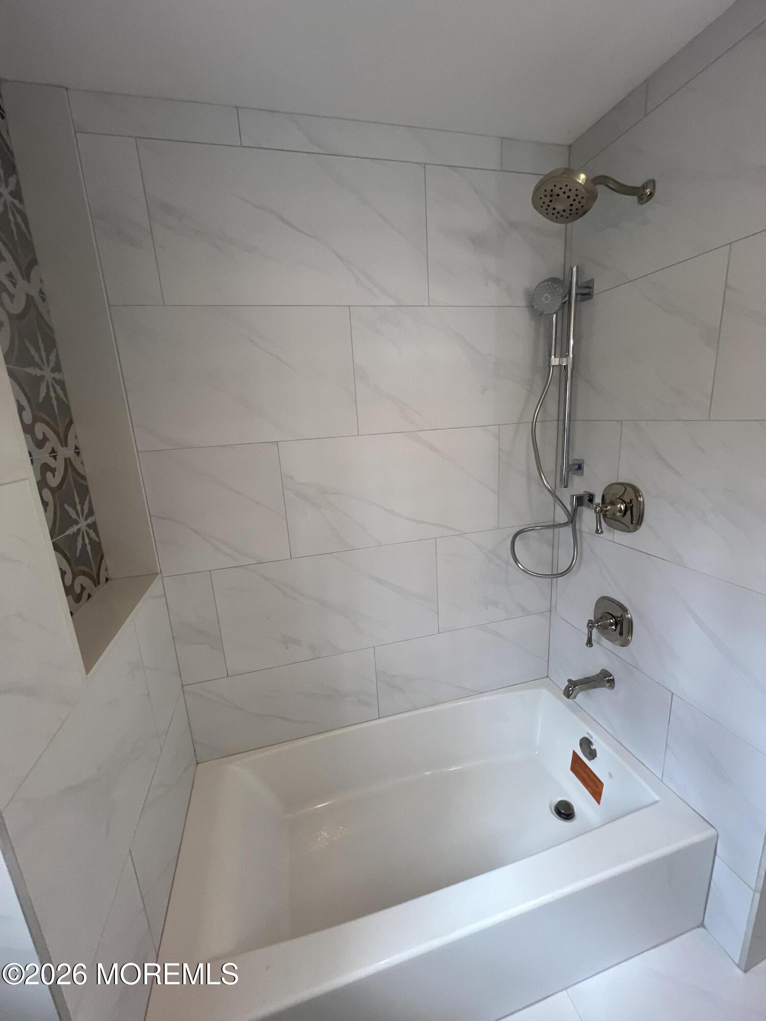 33 Weaverville Road Freehold, NJ 07728 - Photo 4 of 12 a bathroom with a bathtub