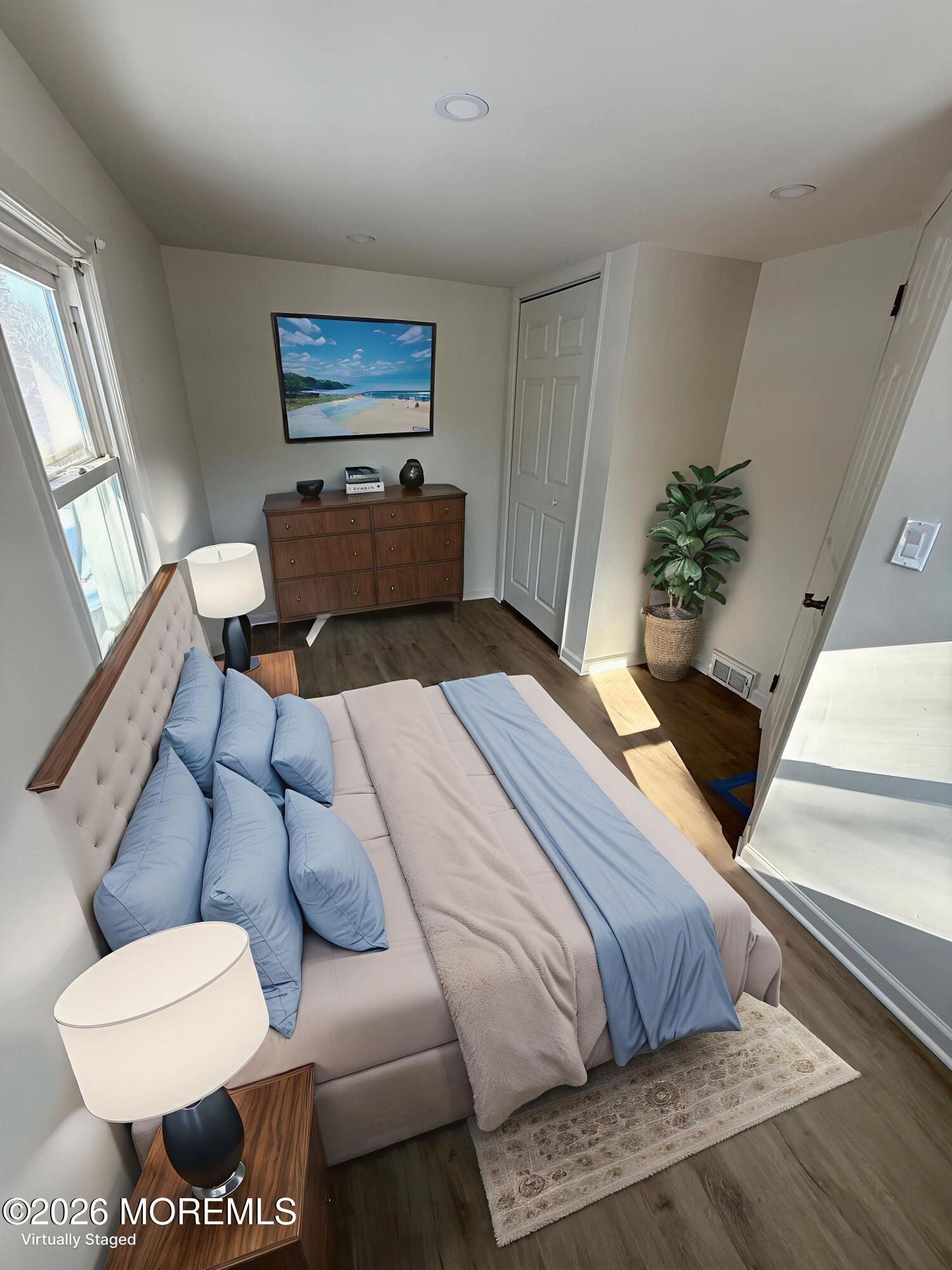 33 Weaverville Road Freehold, NJ 07728 - Photo 4 of 8 a bedroom with furniture and a potted plant