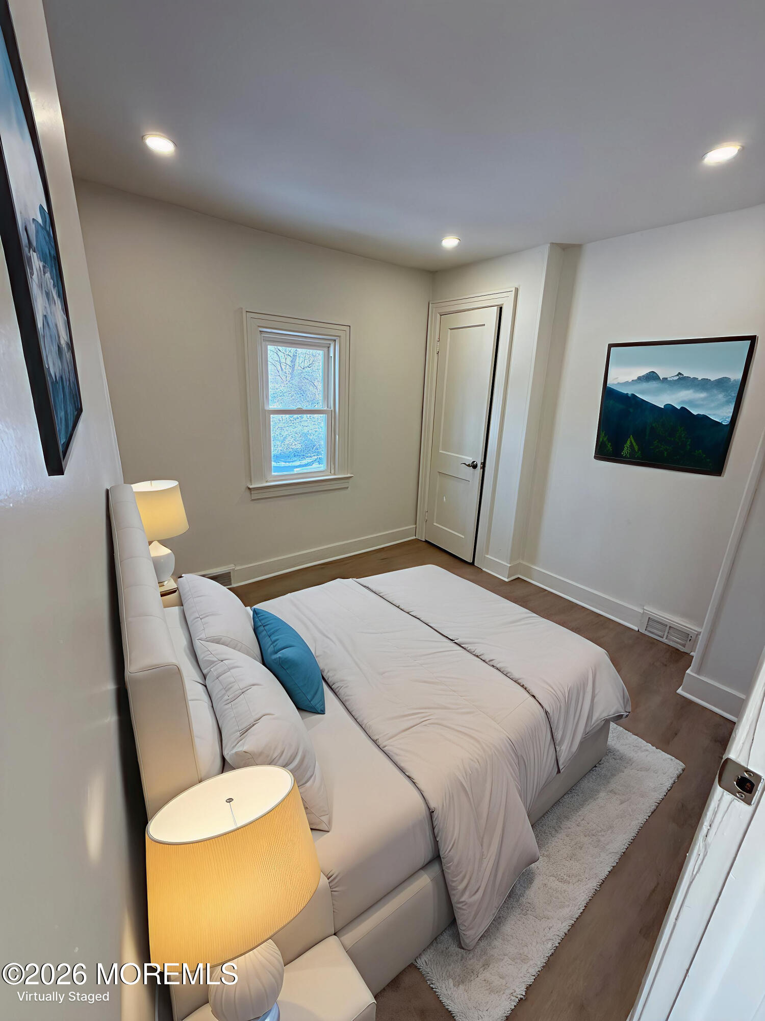 33 Weaverville Road Freehold, NJ 07728 - Photo 6 of 8 a bedroom with a bed and a painting on the wall