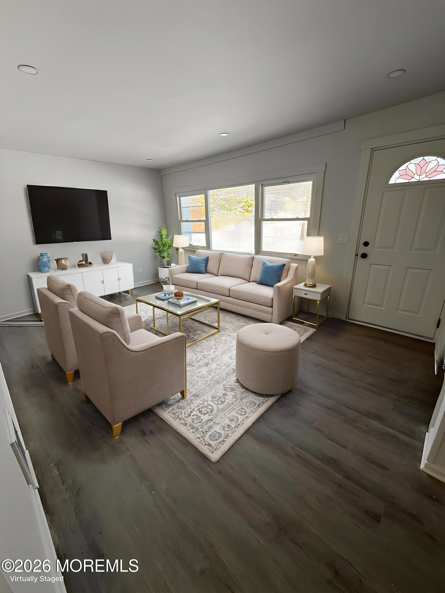 33 Weaverville Road Freehold, NJ 07728 - Photo 7 of 8 a living room with fireplace furniture and a flat screen tv