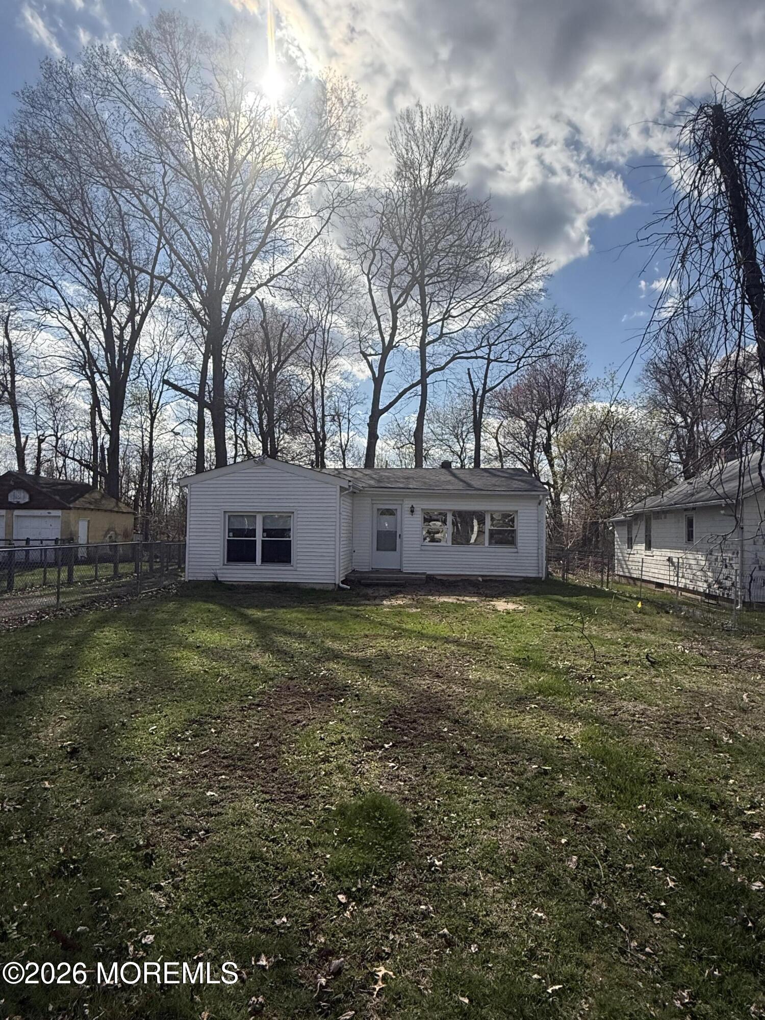 33 Weaverville Road Freehold, NJ 07728 - Photo 9 of 12 a view of a house with a yard