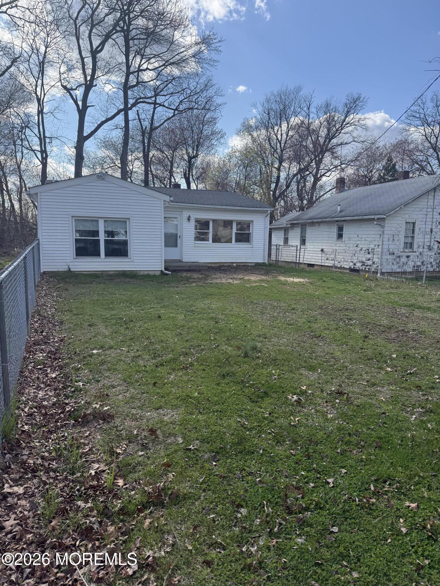33 Weaverville Road Freehold, NJ 07728 - Photo 10 of 12 a view of a yard in front of a house