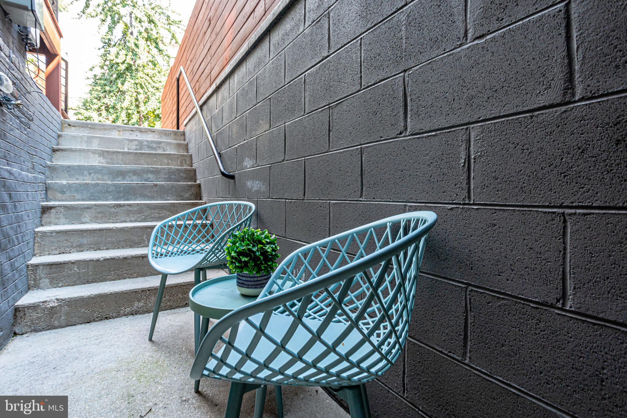 1817 Riggs Place Northwest, Unit 1 Washington, DC 20009 - Photo 28 of 31 common area sitting area and walkway