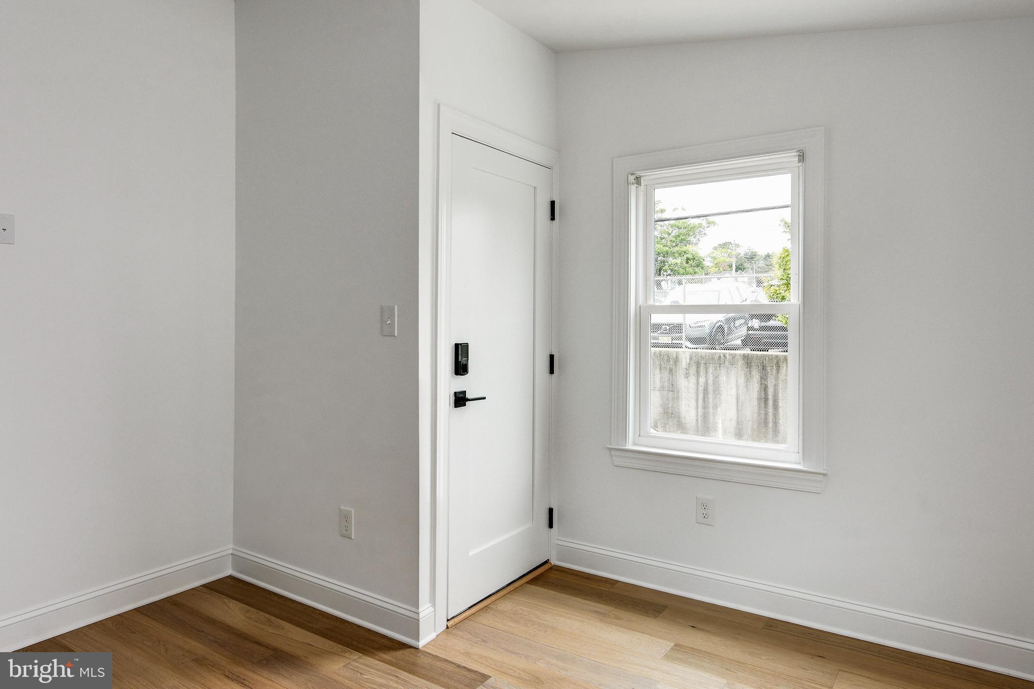 13 Wilkins Avenue Haddonfield, NJ 08033 - Photo 28 of 49 an empty room with wooden floor and windows