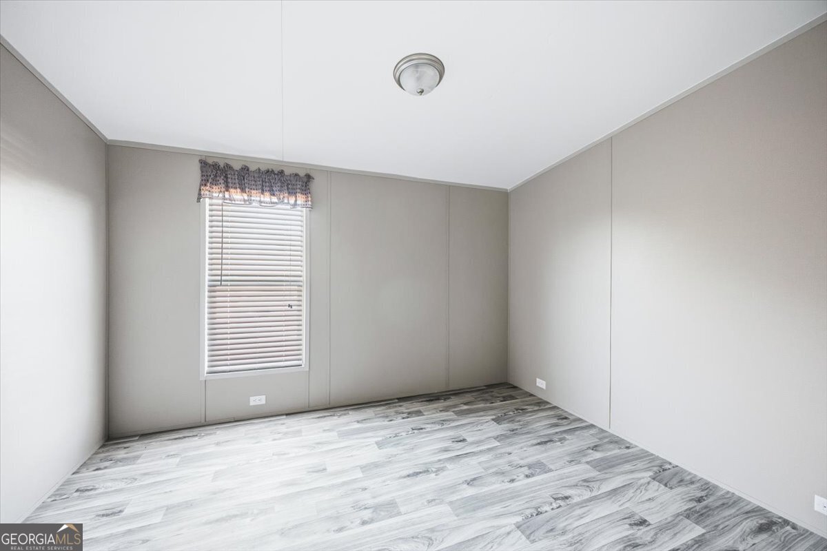 583 Greene Settlement Road Gray, GA 31032 - Photo 13 of 25 an empty room with windows