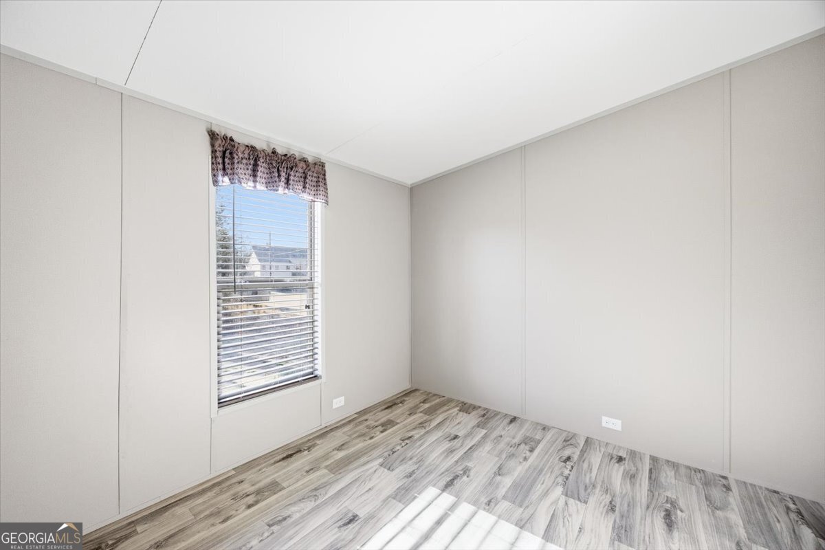 583 Greene Settlement Road Gray, GA 31032 - Photo 18 of 25 a view of wooden floor and windows in a room