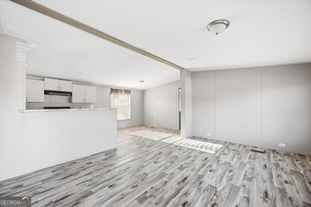 583 Greene Settlement Road Gray, GA 31032 - Photo 4 of 25 a view of a kitchen with microwave and cabinets