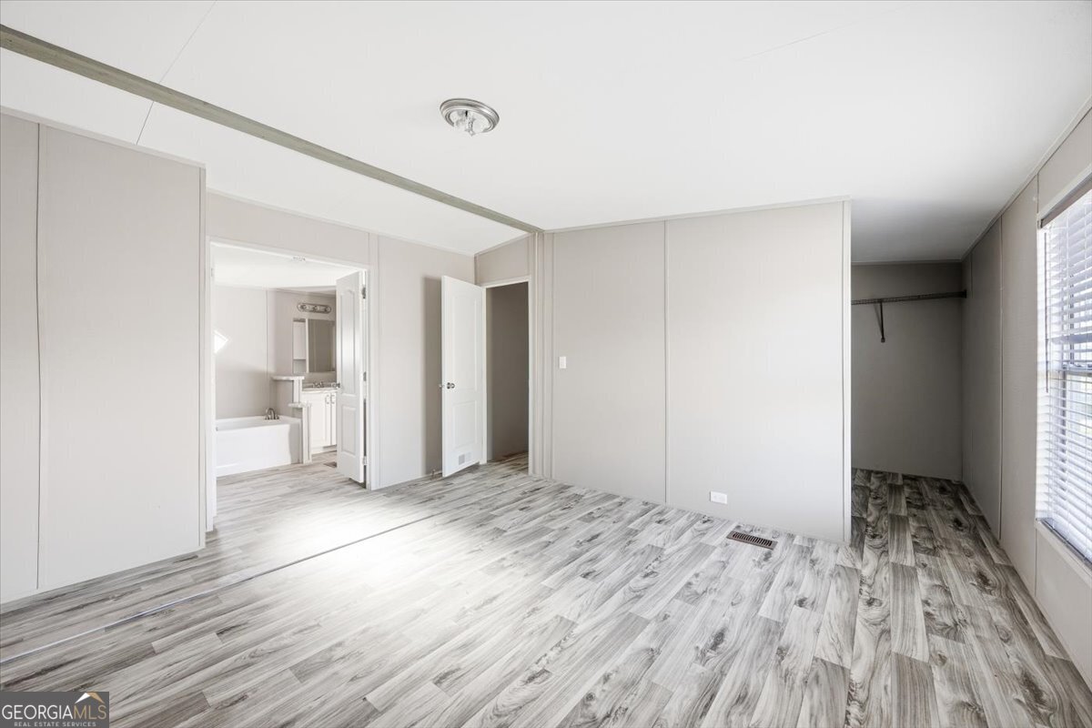 583 Greene Settlement Road Gray, GA 31032 - Photo 10 of 25 a view of empty room with wooden floor
