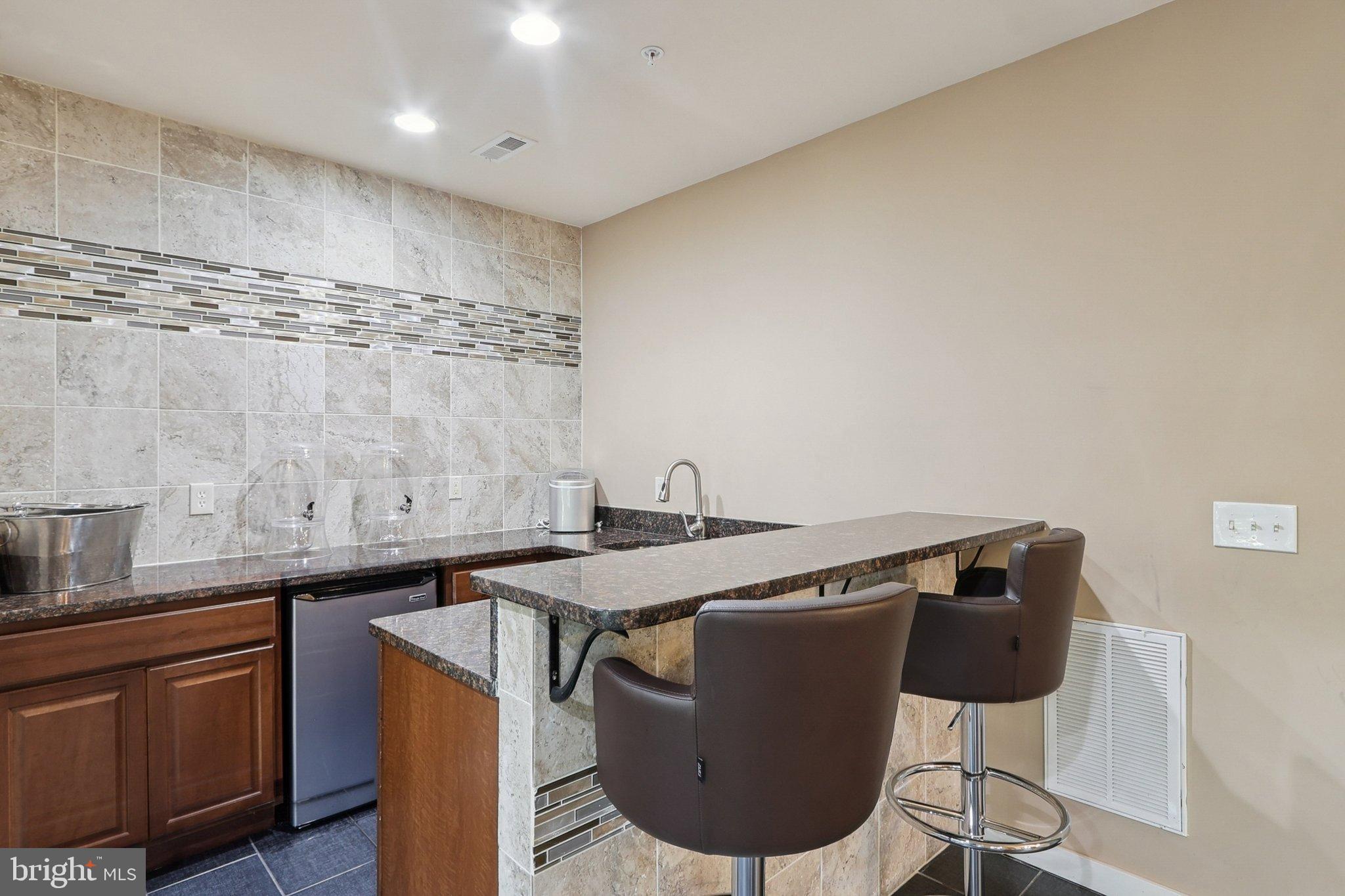 3211 Courtside Road Bowie, MD 20721 - Photo 80 of 108 Sleek modern bar area with stylish finishes.